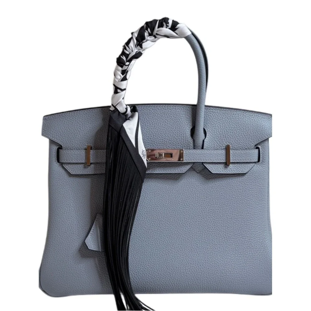 Trendy Fringe Handbag Wrap with black fringe and bold white flower pattern
